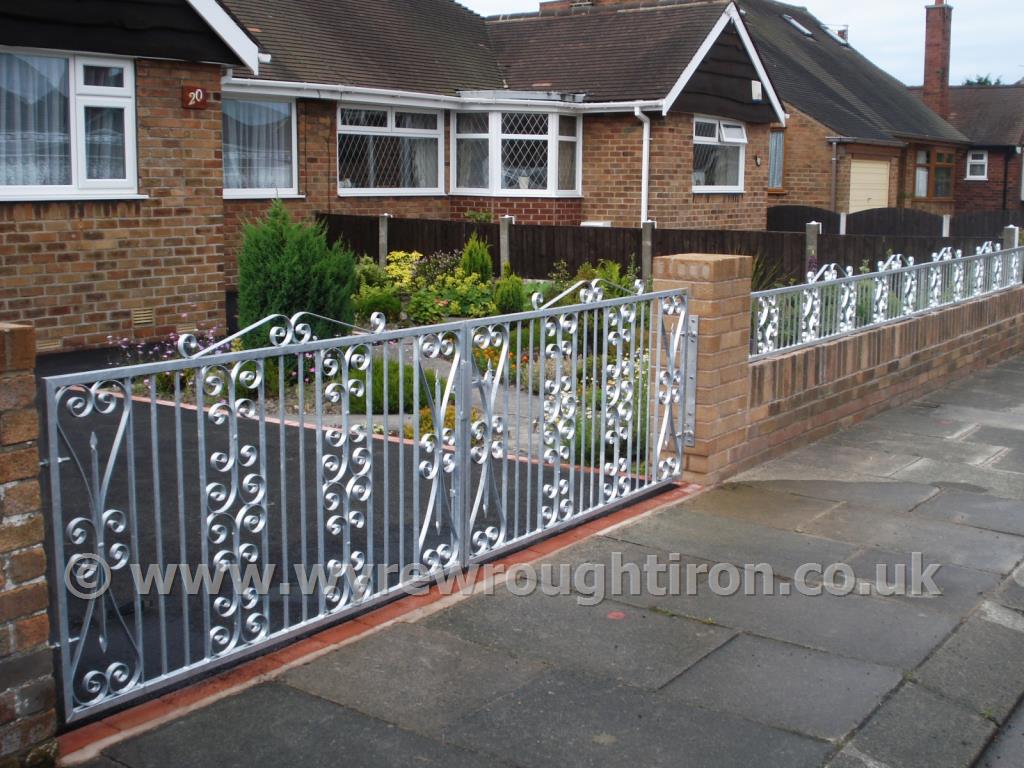 Photo - Double flat top gates with top scrolls and galvanised finish, Thornton-Cleveleys