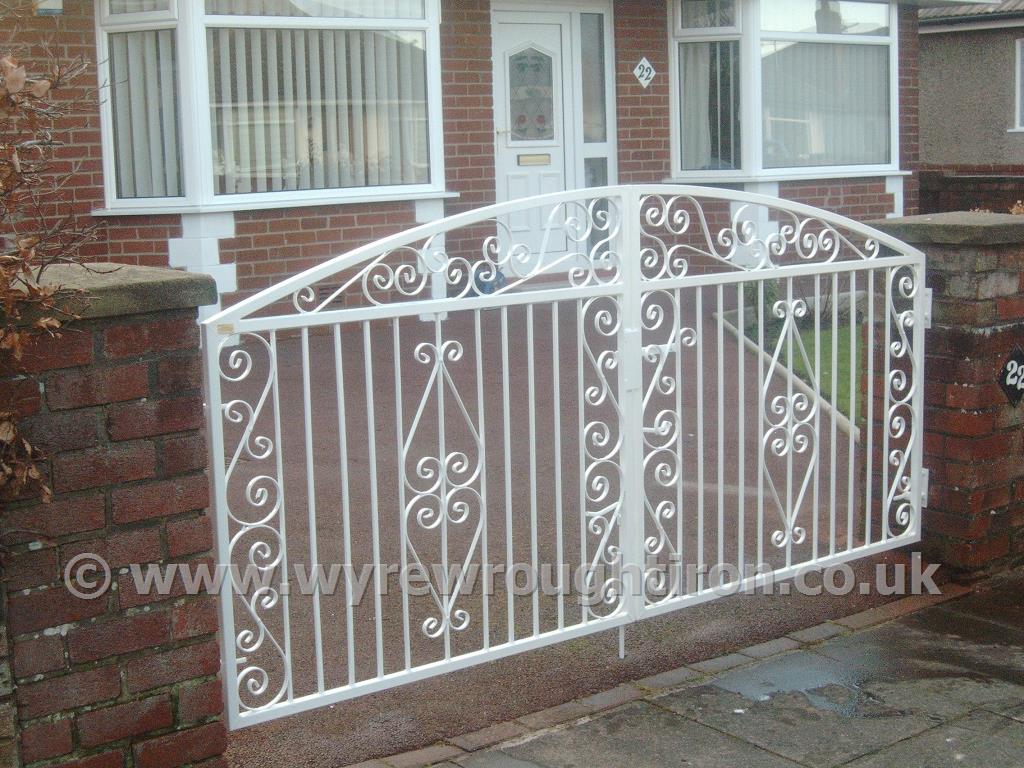Double arch driveway gates in Thames design with white powder coated finish. Fitted to garden in Bispham, Blackpool