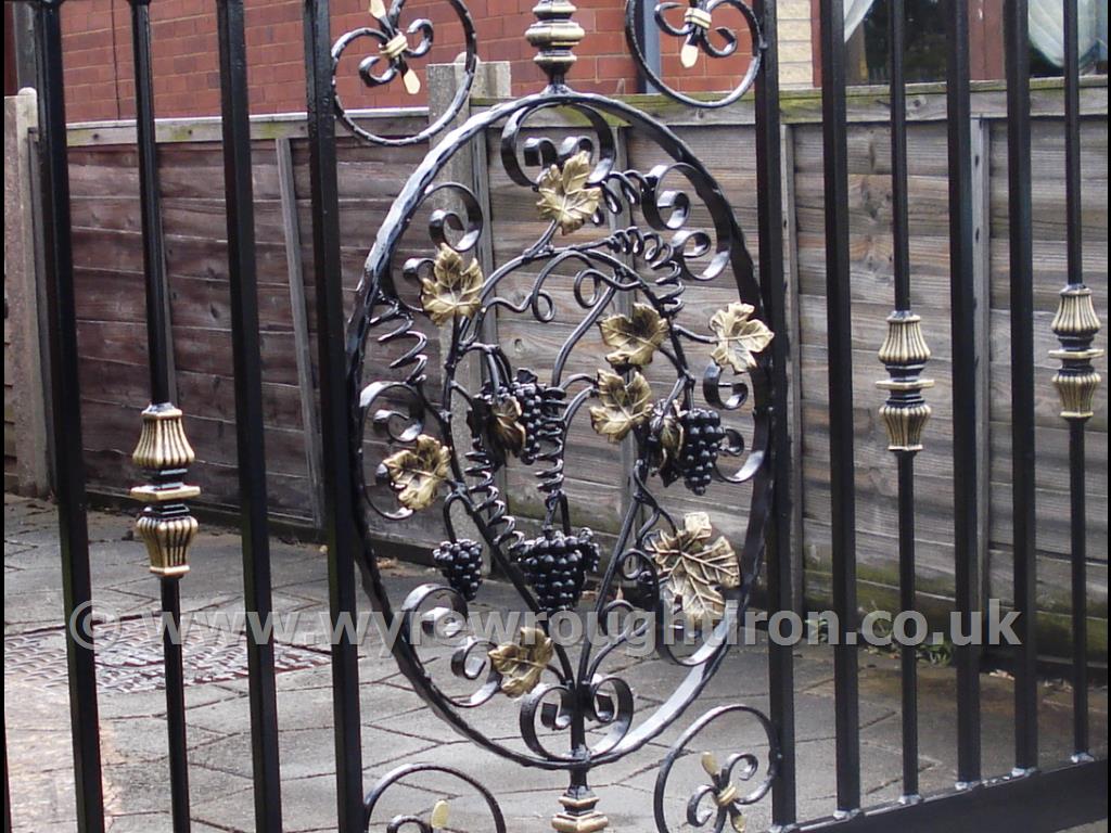 Detail of bespoke design for single driveway gate in Cleveleys, near Blackpool. Features intricate grapevine centrepiece with hand painted finishing.