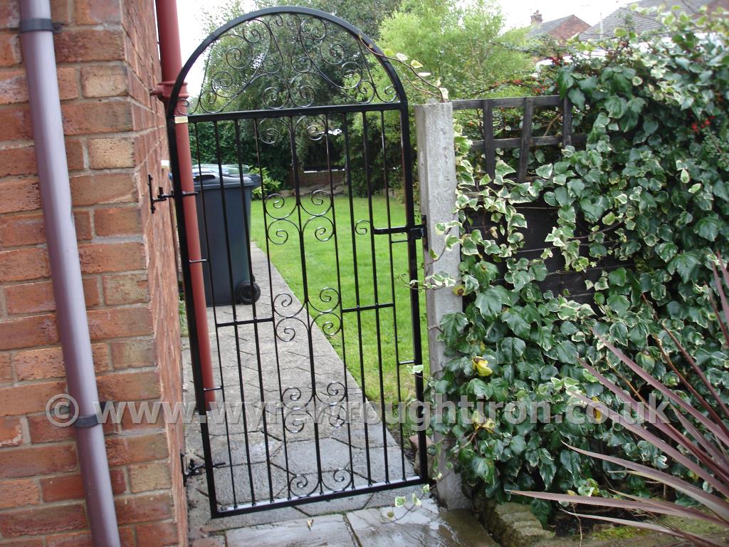 Tall single rear garden gate in C Scroll design with black powder coated finish. Completed for customer in Wrea Green, near Kirkham.