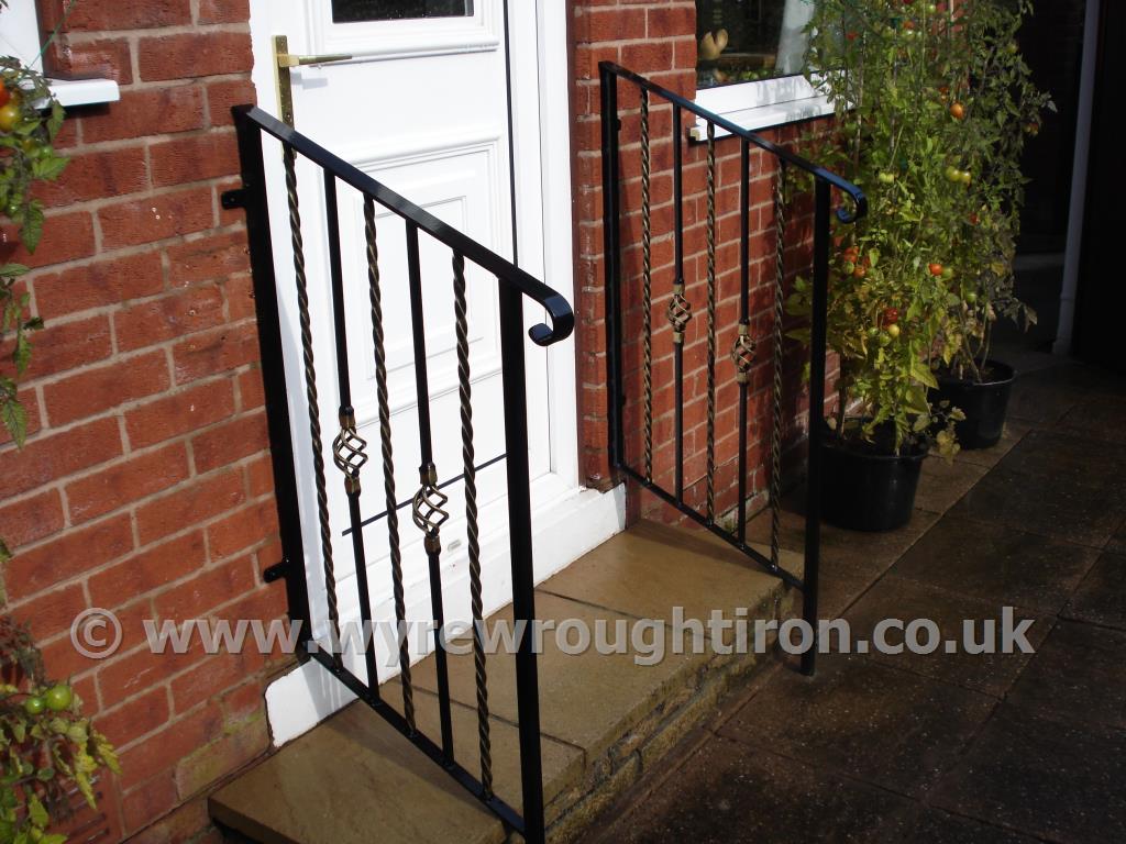 Ornate handrails with twisted bar infill and cage twists. Galvanised, powder-coated in black and fitted for a customer in Normoss, Blackpool.