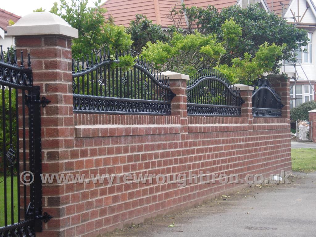 Photo - Black arched top railings with railheads and scrolled tail circles, Thornton-Cleveleys