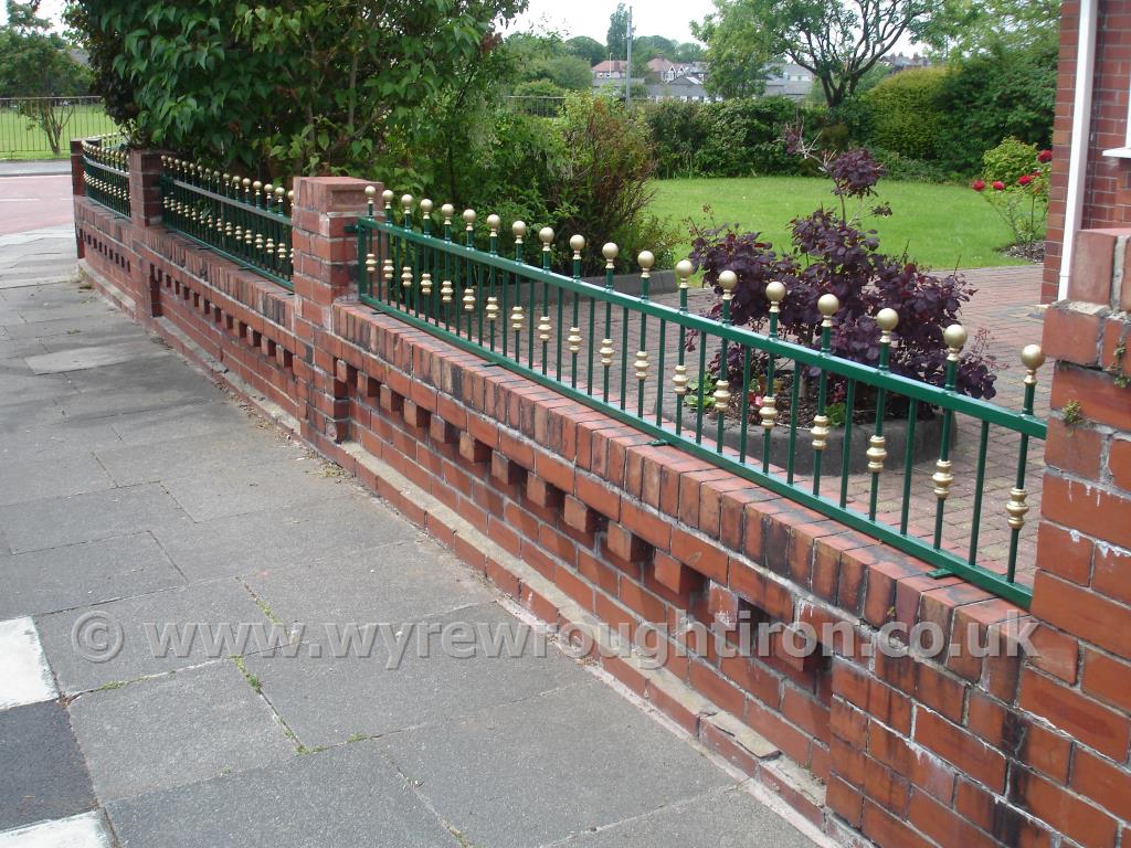 Flat top railings with ball railheads and barrels. Galvanised, powder coated in green with hand painted gold finishing for a Poulton-le-Fylde customer.